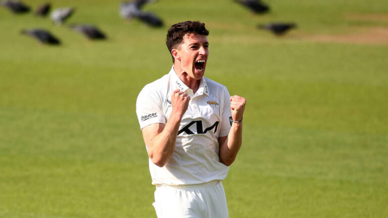 Fisher strikes between showers but weather frustrates Surrey